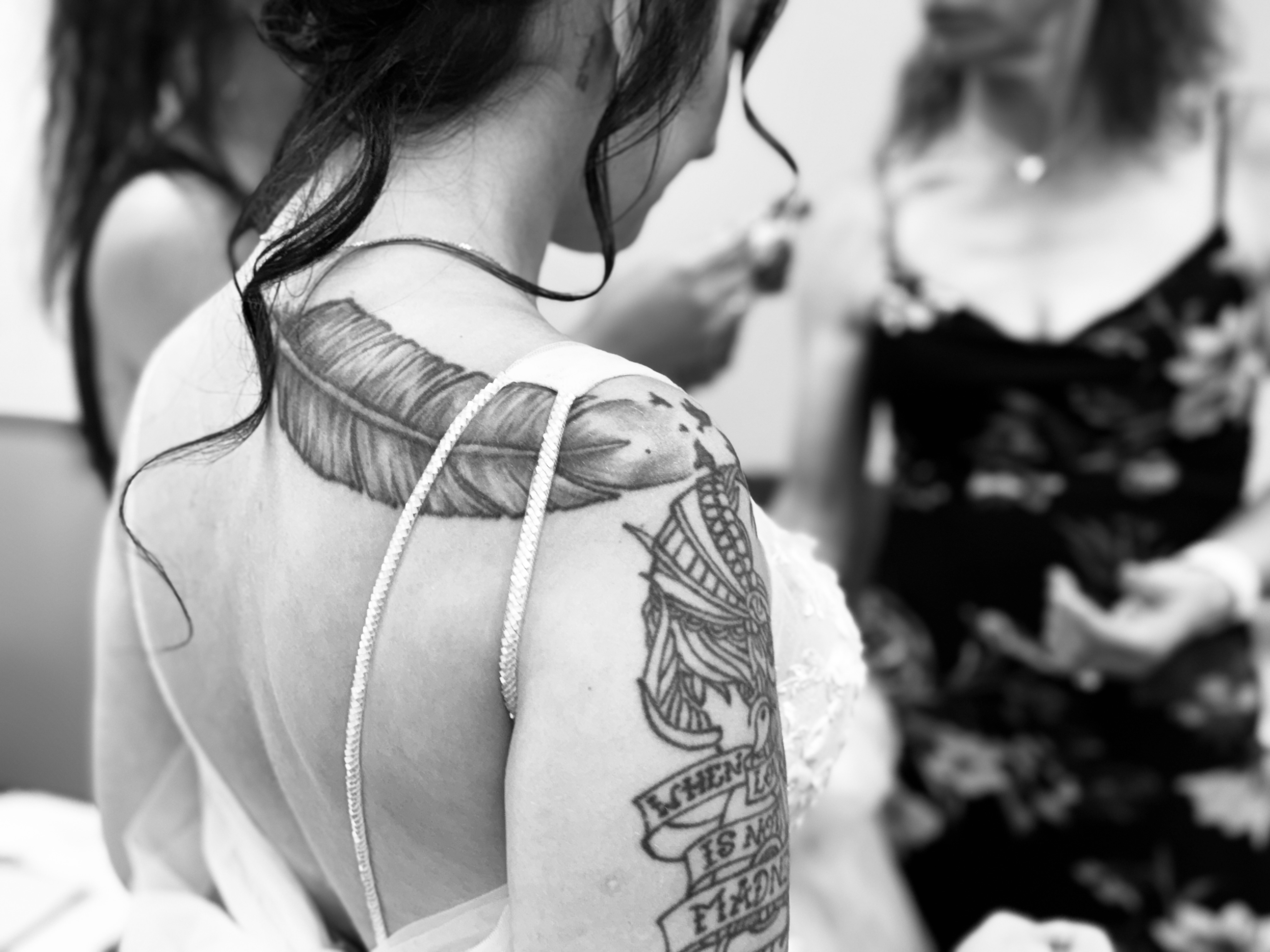 Bride showing beautiful tattoo artwork