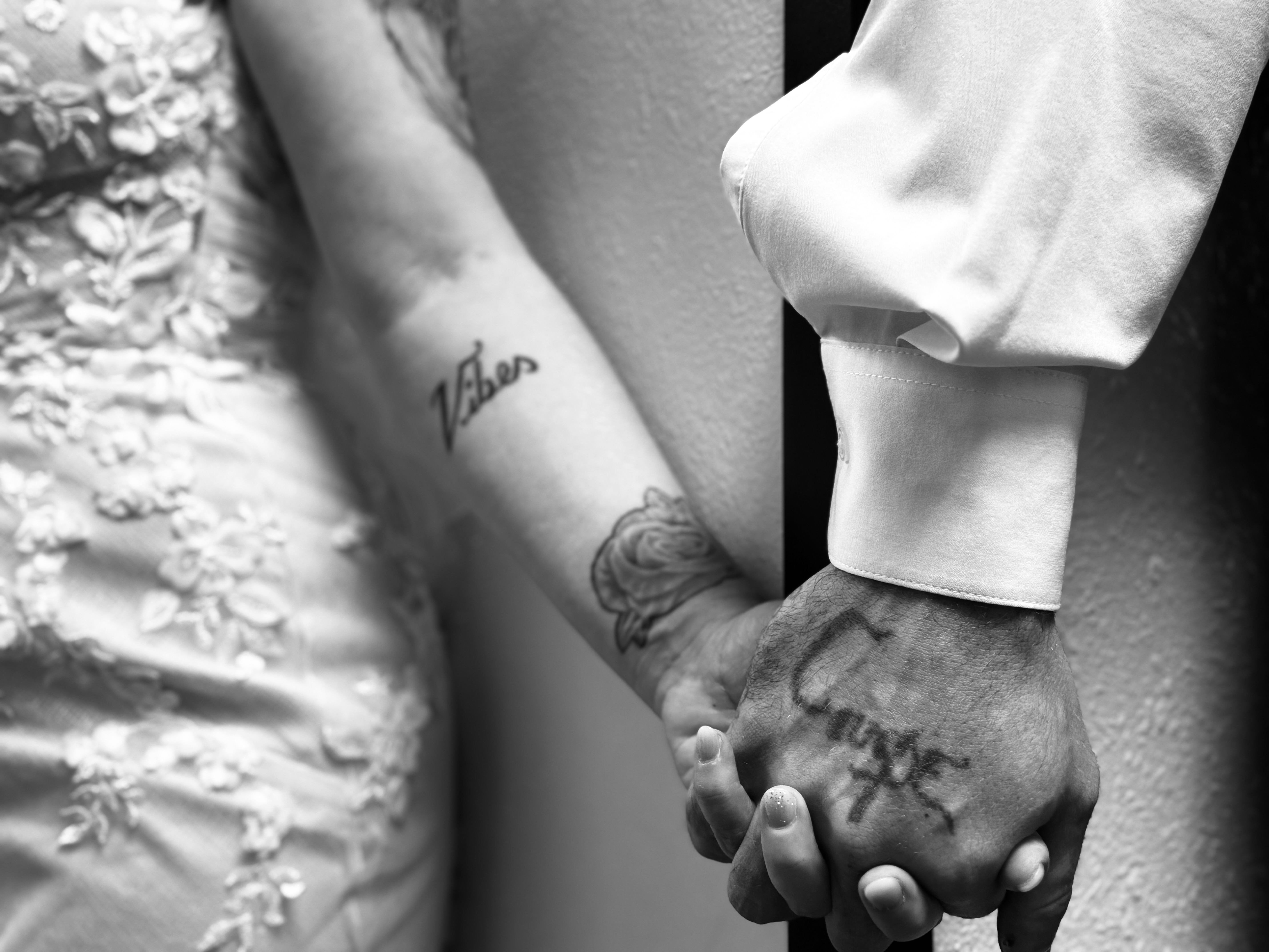 Couple's hands with matching tattoos